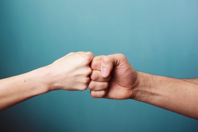 fist-bump-shutterstock_176659706